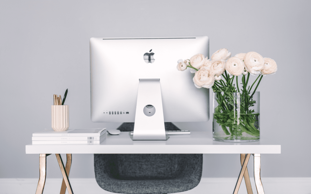 Apple Computer and roses on desk