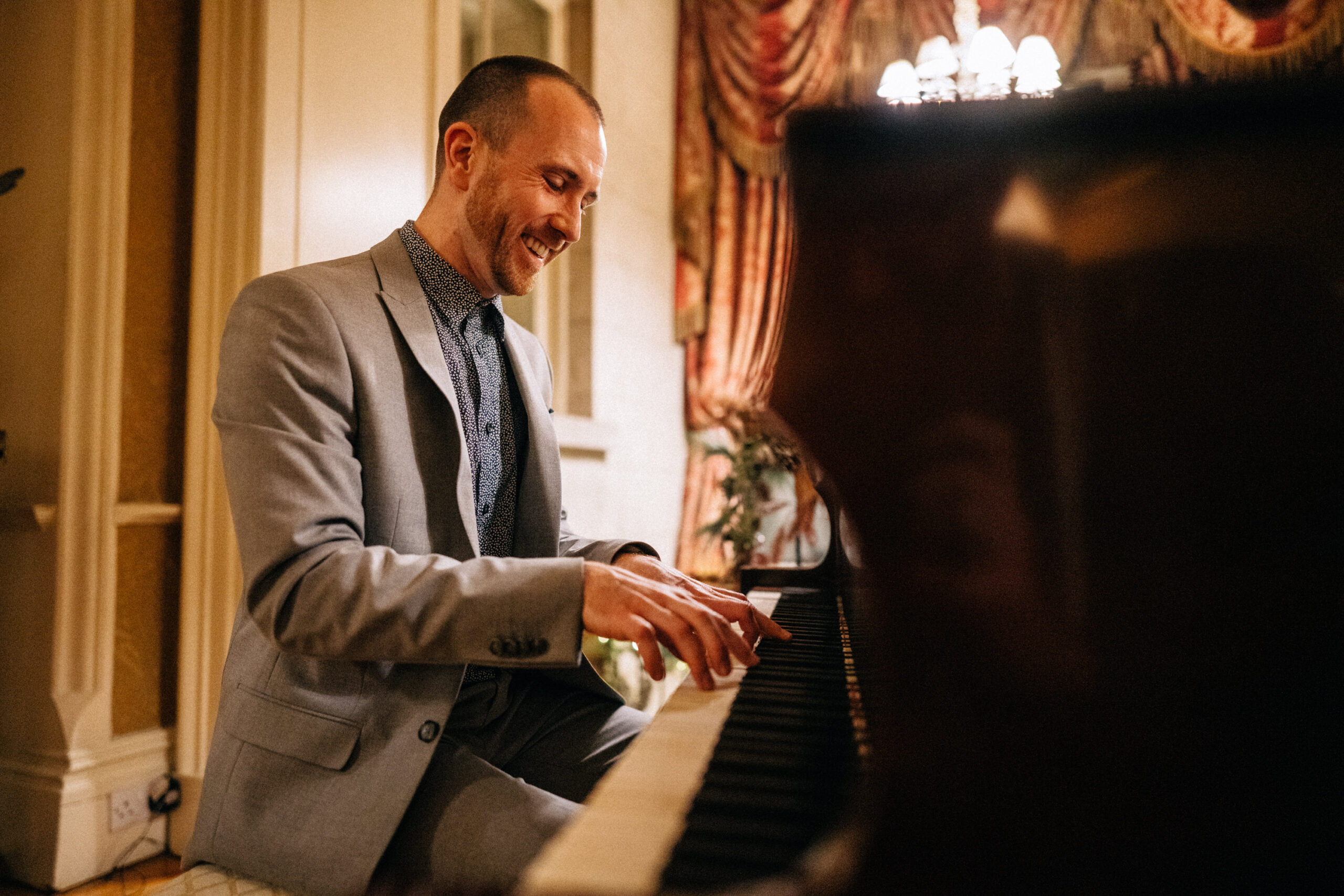 Joe Kenny playing baby grand piano In Tankardstown House Co Meath
