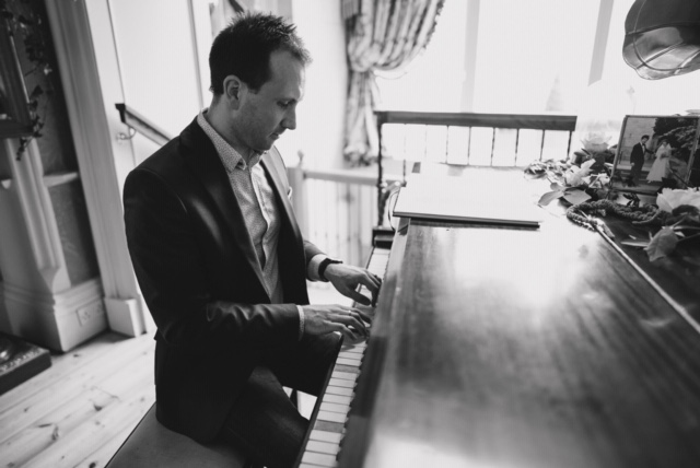 Joe Kenny playing grand piano over wedding drinks reception in Luttrellstown Castle, Co. Dublin