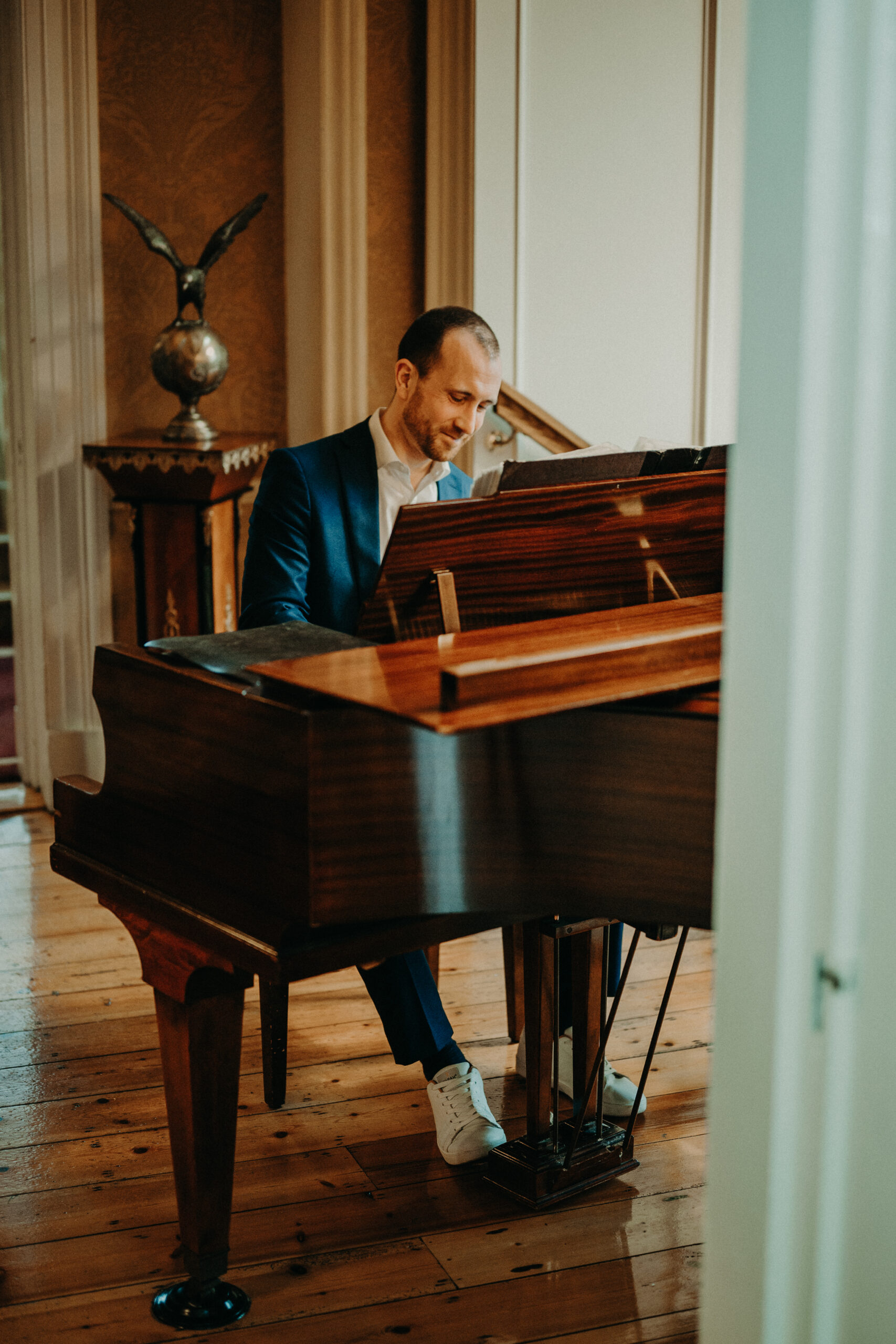 Joe Kenny playing grand piano in Ballymagarvey Village over wedding drinks reception